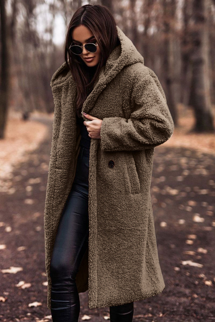 Woman in long hooded teddy coat