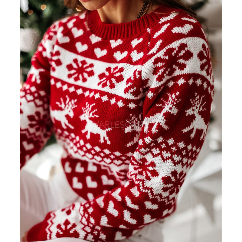Woman in a reindeer jacquard sweater