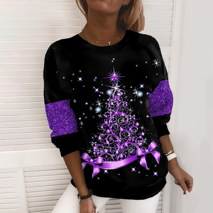 Woman in a glittery Christmas tree sweatshirt