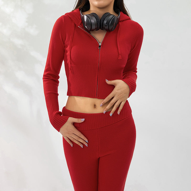 Woman in ribbed knit hoodie and flare pants set