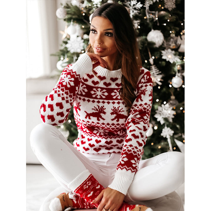Woman in a reindeer jacquard sweater