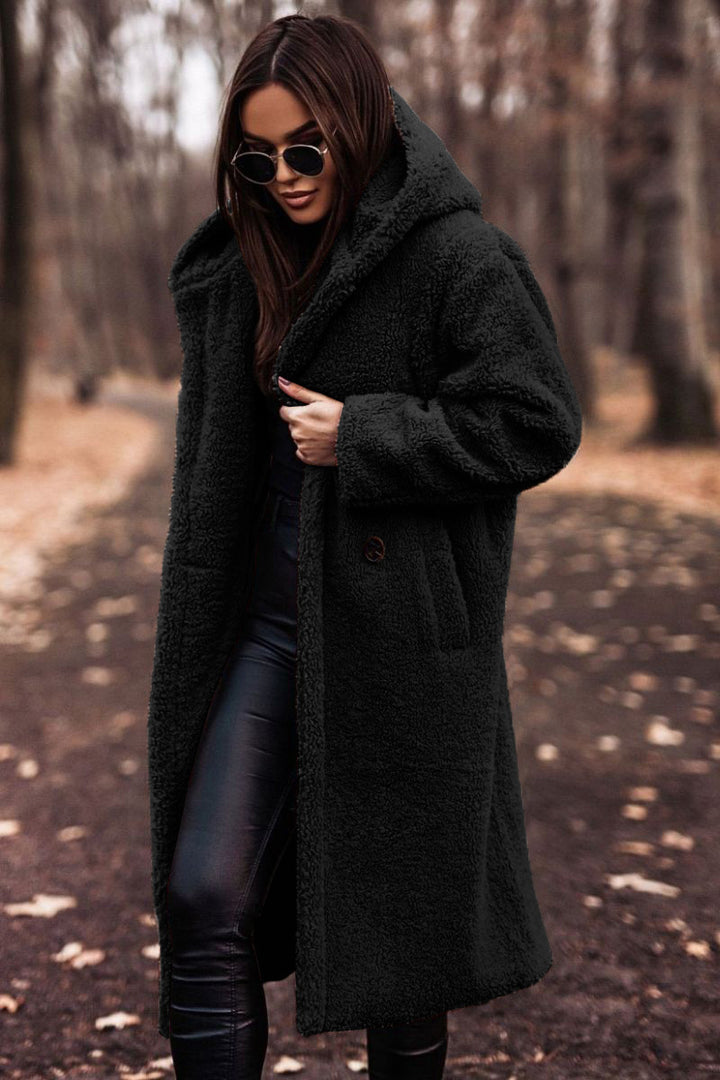 Woman in long hooded teddy coat