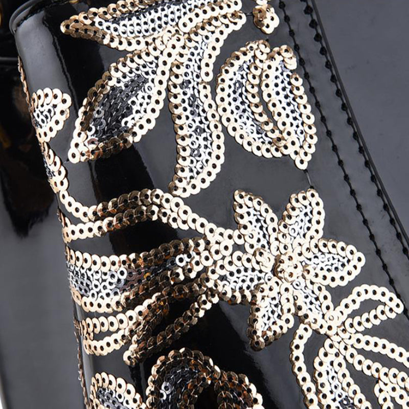 Sequin embroidered patent leather handbag
