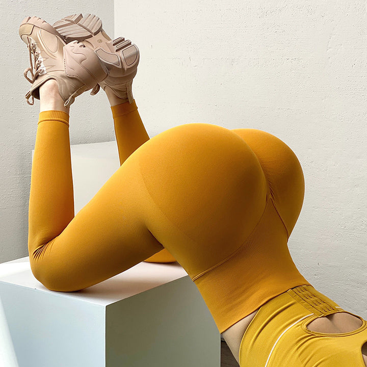 Woman wearing scrunch butt leggings