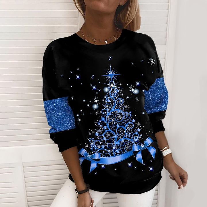 Woman in a glittery Christmas tree sweatshirt