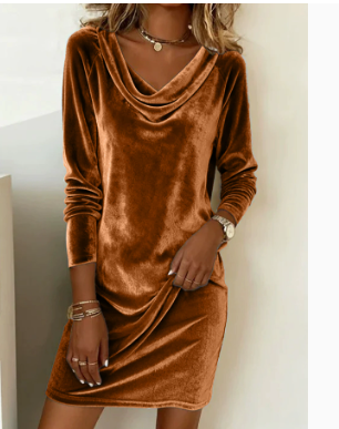 Woman in a velvet cowl neck mini dress