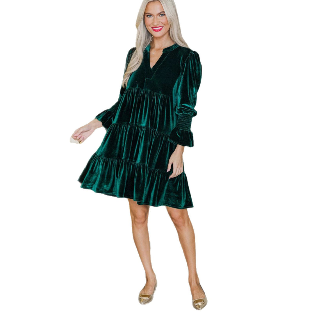 Woman in a green velvet mini dress