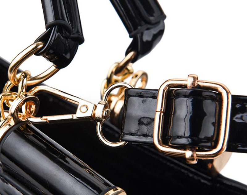 Sequin embroidered patent leather handbag