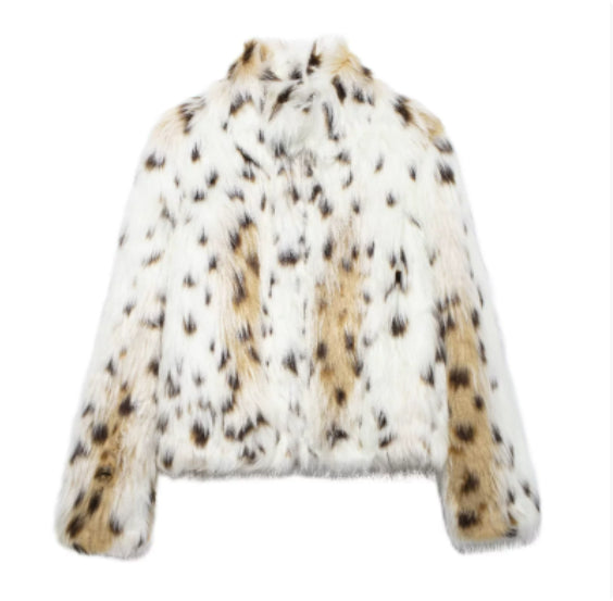Woman in cropped fluffy faux fur jacket