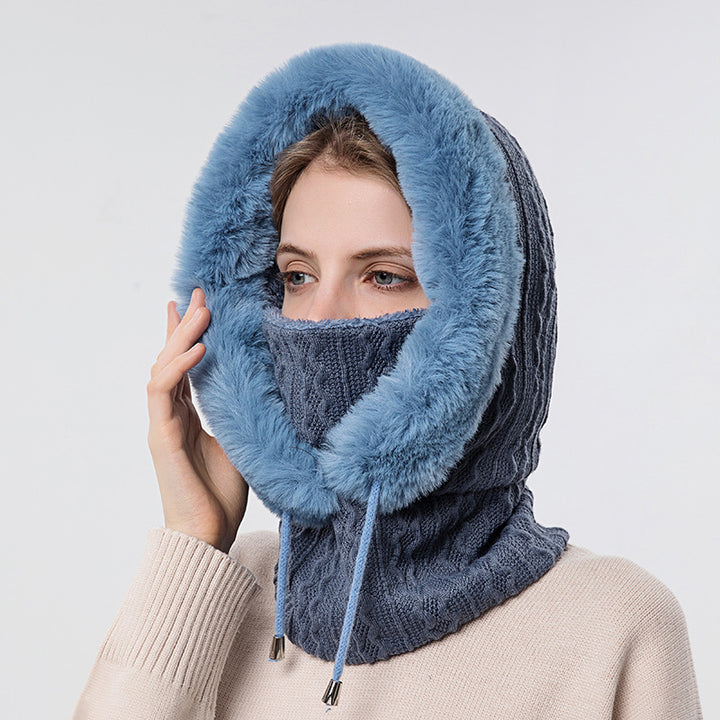 Woman wearing knit hood with faux fur trim