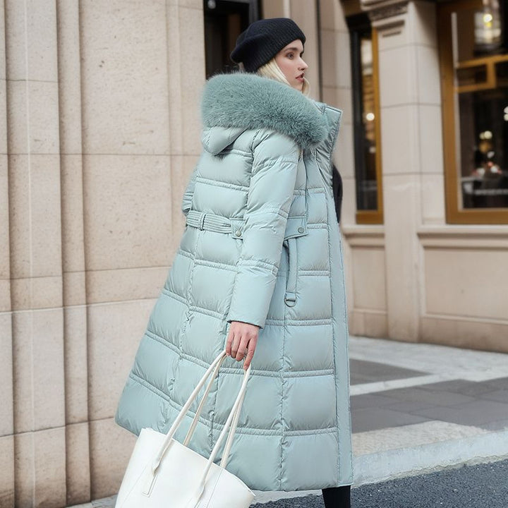 Woman in a long parka with fur hood