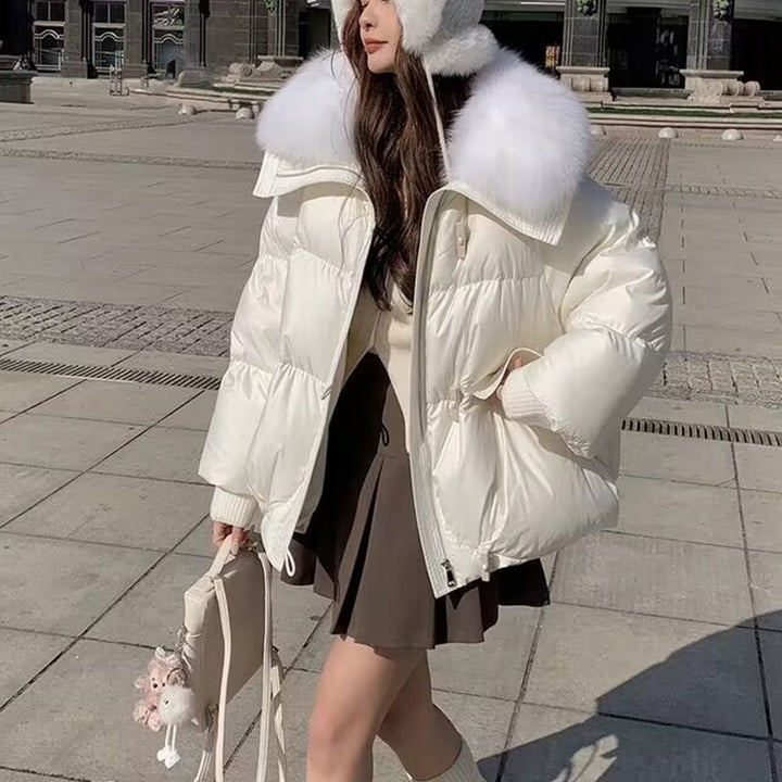 Woman in short puffer jacket with fur collar