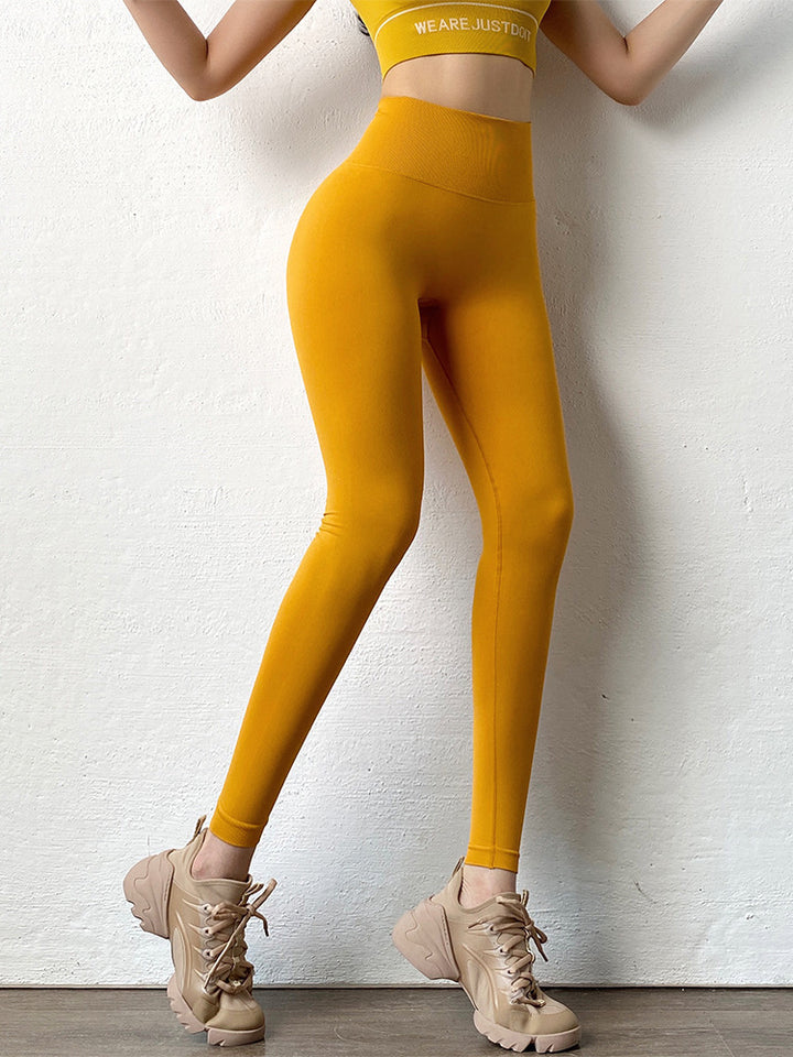 Woman wearing scrunch butt leggings